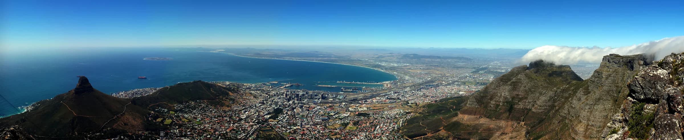 Panoramic view over Cape Town, with Table Mountain and Lion’s Head above the city and Atlantic coastline